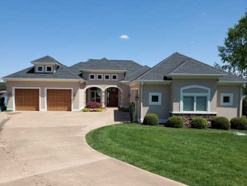 Residential property showing a clean garage facade and driveway